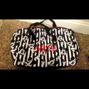 Mickey Duffel Bag monogrammed in red to say TAYLOR